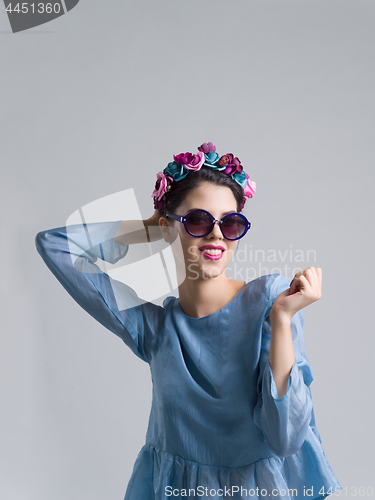 Image of woman posing in fashionable clothes and sunglasses