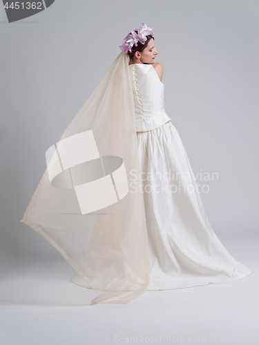 Image of Rear view of a beautiful young woman in a wedding dress