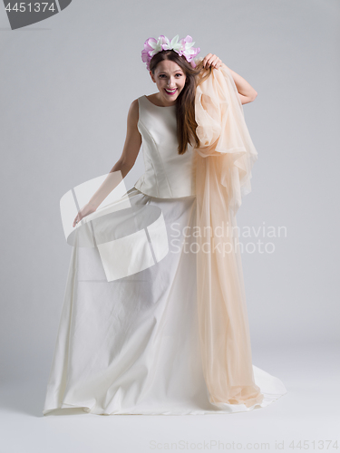 Image of young bride in a wedding dress with a veil