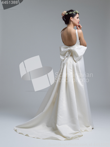 Image of Rear view of a beautiful young woman in a wedding dress