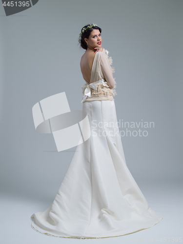 Image of Rear view of a beautiful young woman in a wedding dress