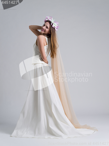 Image of young bride in a wedding dress with a veil