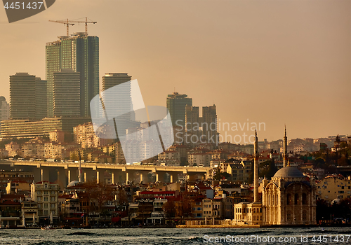 Image of Ortakoy mosque under bosphorus bridge in istanbul, turkey. Bosphorus bridge between asia and europe.