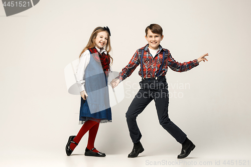 Image of Cute stylish children on white studio background