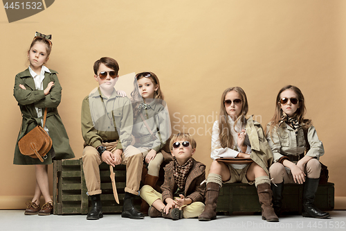 Image of The group of beautiful girls and boys on a pastel background