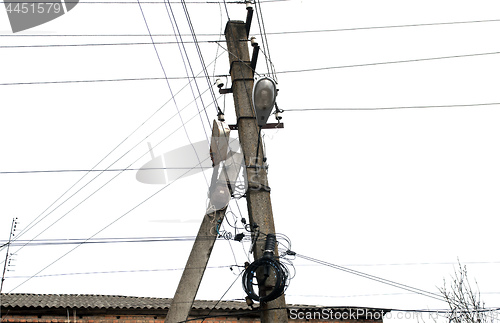 Image of concrete column with electrical wires