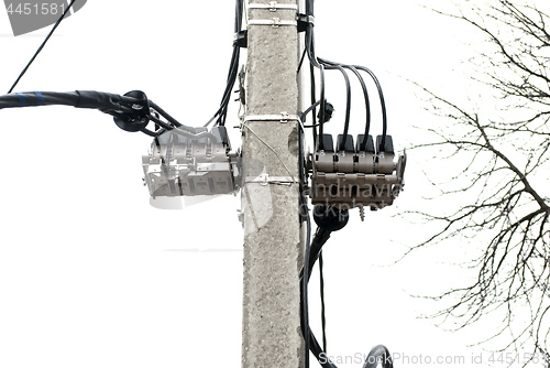 Image of electric pole with attachments