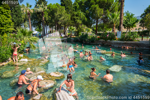 Image of Tourists swim in antique Cleopatra pool