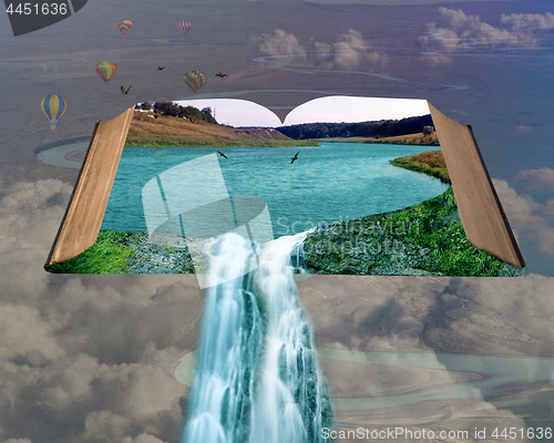 Image of an open book with a waterfall and birds