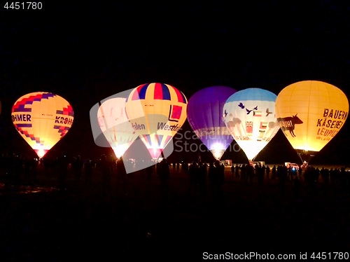 Image of The glow of hot air balloons at night during the World Ploughing Competition in Germany 2018