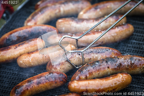 Image of Crispy wieners on an outdoor grill
