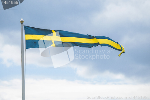 Image of Swedish pennant flag on a flagpole in the wind