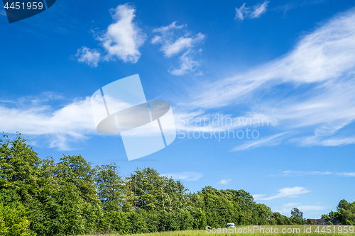 Image of Camping trailer on a green field