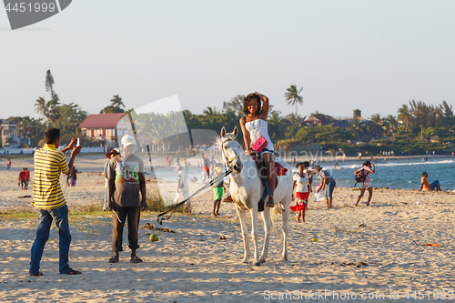 Image of Malagasy beauty, beautiful girls ride horse on the beach