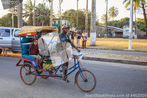 Image of Traditional rickshaw bicycle with malagasy peoples in Toamasina,