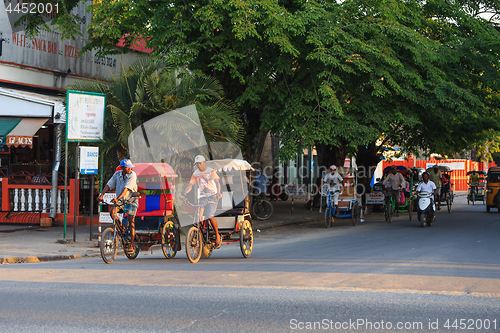 Image of Traditional rickshaw bicycle with malagasy peoples in Toamasina,