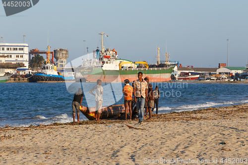 Image of Malagasy peoples resting on the beach in harbor