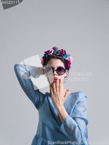 Image of woman posing in fashionable clothes and sunglasses