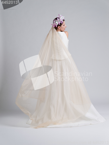 Image of Rear view of a beautiful young woman in a wedding dress