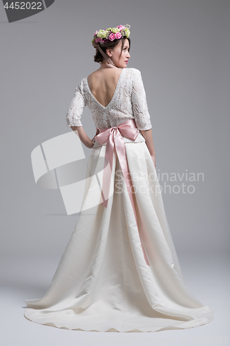 Image of Rear view of a beautiful young woman in a wedding dress