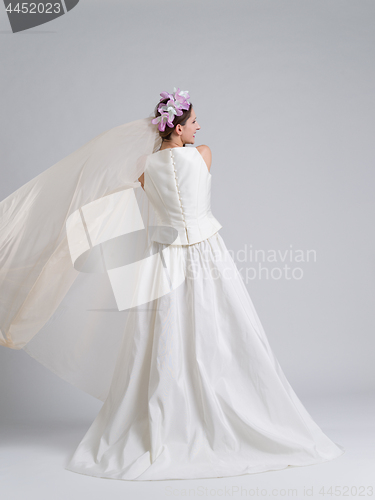 Image of Rear view of a beautiful young woman in a wedding dress