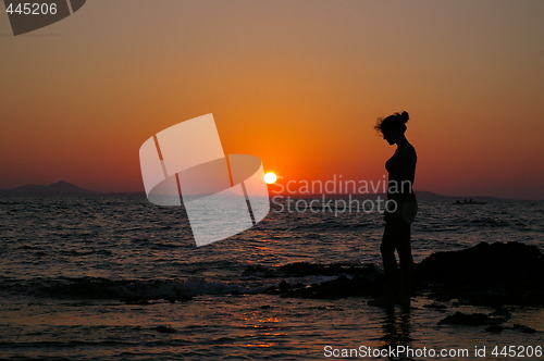 Image of Girl in silouette and sunset