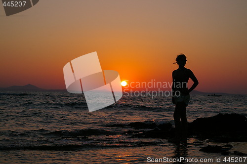 Image of Girl in silouette and sunset