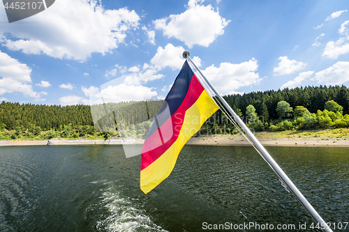 Image of German flag on a boat in the summer