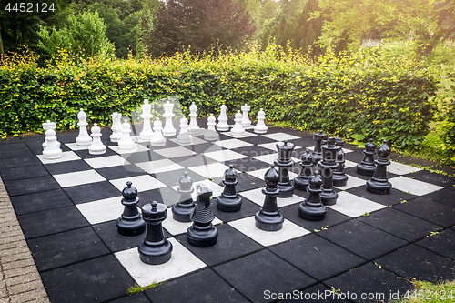 Image of Large outdoor chess game on a garden terrace