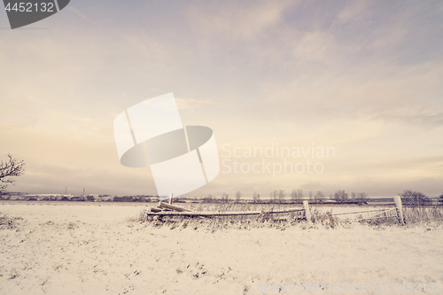 Image of Wooden fence in a winter landscape