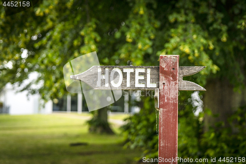 Image of Hotel sign in the shape of an arrow