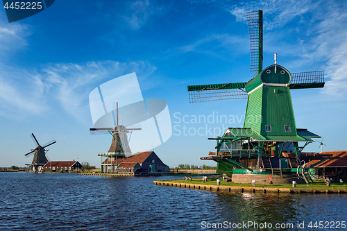 Image of Windmills at Zaanse Schans in Holland on sunset. Zaandam, Nether