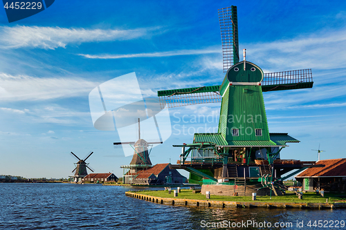 Image of Windmills at Zaanse Schans in Holland on sunset. Zaandam, Nether