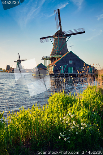 Image of Windmills at Zaanse Schans in Holland on sunset. Zaandam, Nether