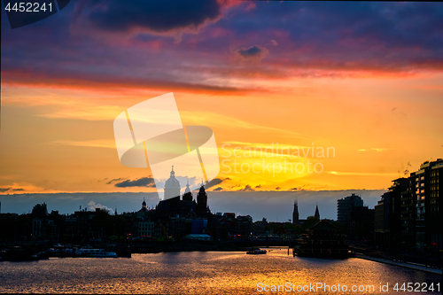 Image of Amsterdam cityscape skyline with  Church of Saint Nicholas on su