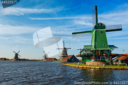 Image of Windmills at Zaanse Schans in Holland on sunset. Zaandam, Nether