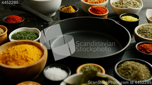 Image of Bowls with spices and pan