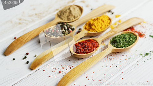 Image of Composition of wooden spoons with spices