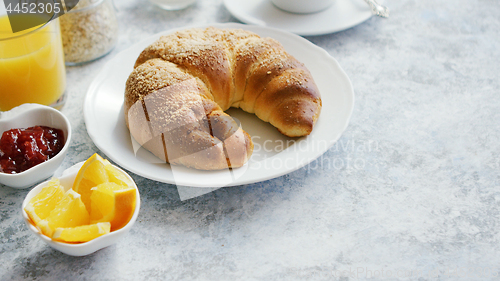 Image of Delicious croissant with juice