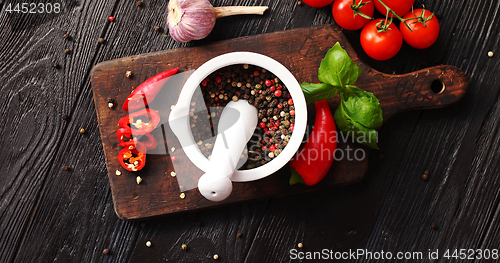 Image of Bowl with spices on chopping board