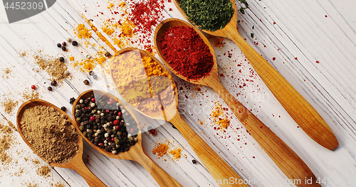 Image of Creative layout of spoons with spices