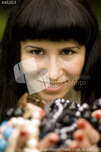 Image of brunette with beads