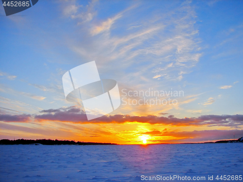 Image of Winter sunset over frozen Baltic Sea in Finland