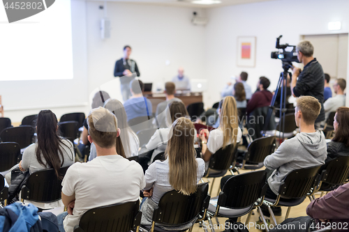 Image of Professor lecturing in lecture hall at university.