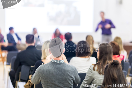 Image of Speaker giving presentation on business conference.