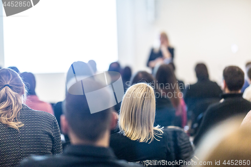 Image of Woman giving presentation on business conference workshop.