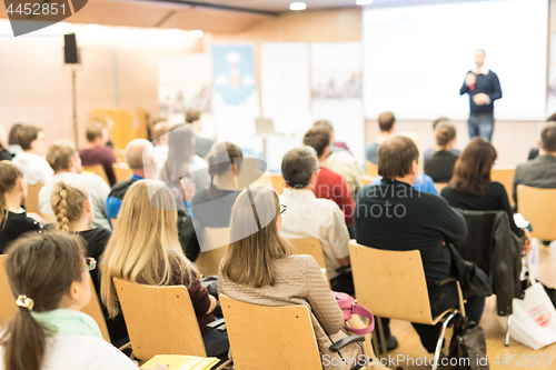 Image of Business speaker giving a talk at business conference event.