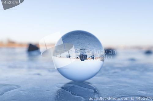 Image of Crystal ball on a frozen lake in the winter