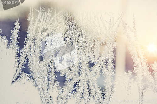 Image of Sunrise behind a frosty window