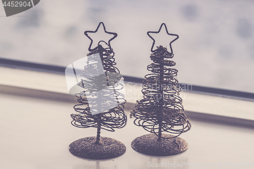 Image of Two small decorative Christmas trees